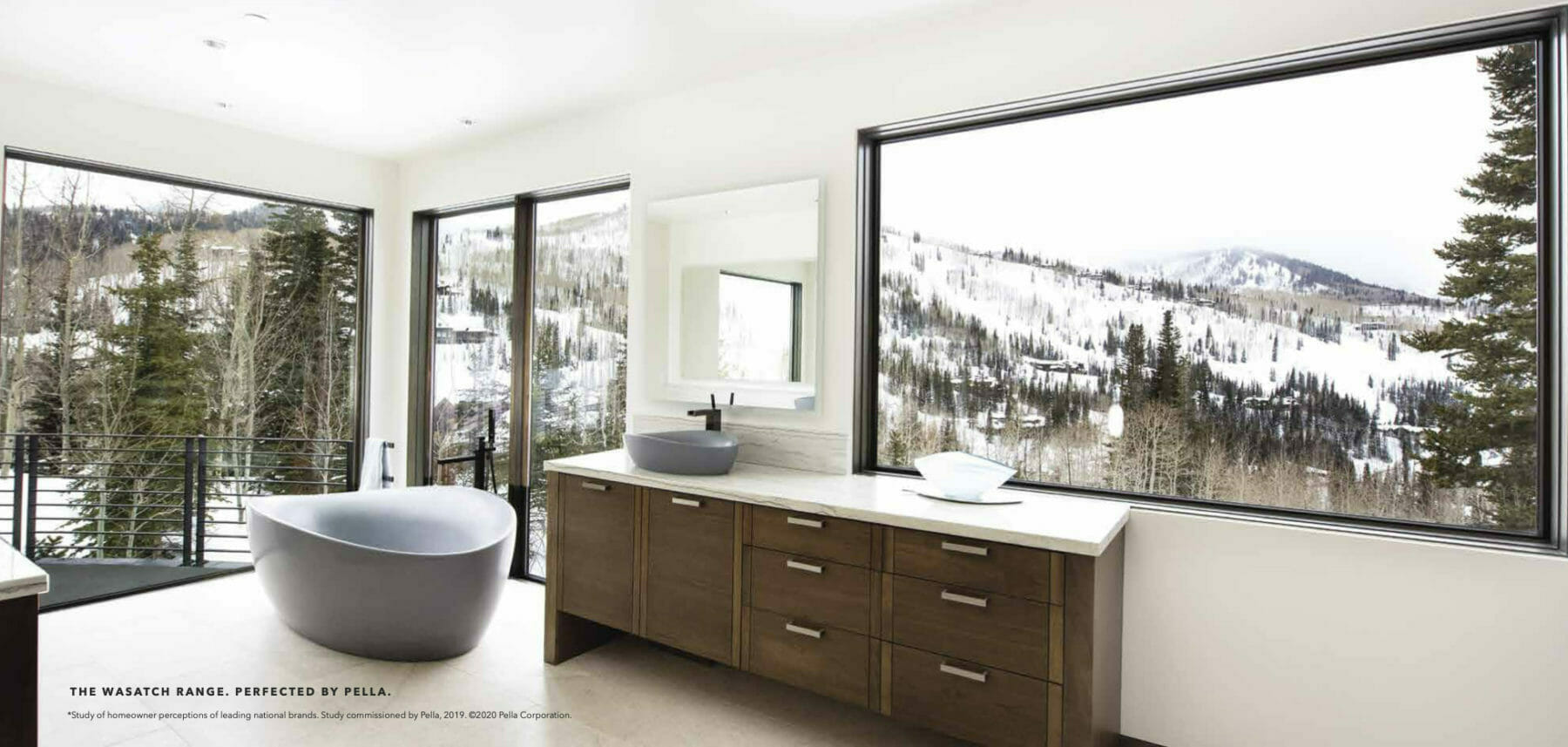 This bathroom has views of the snowy wasatch mountains of Utah
